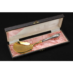 Gilded dessert serving spoon with engraving