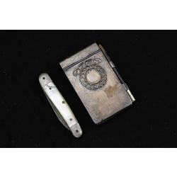 Silver block with pearl knife