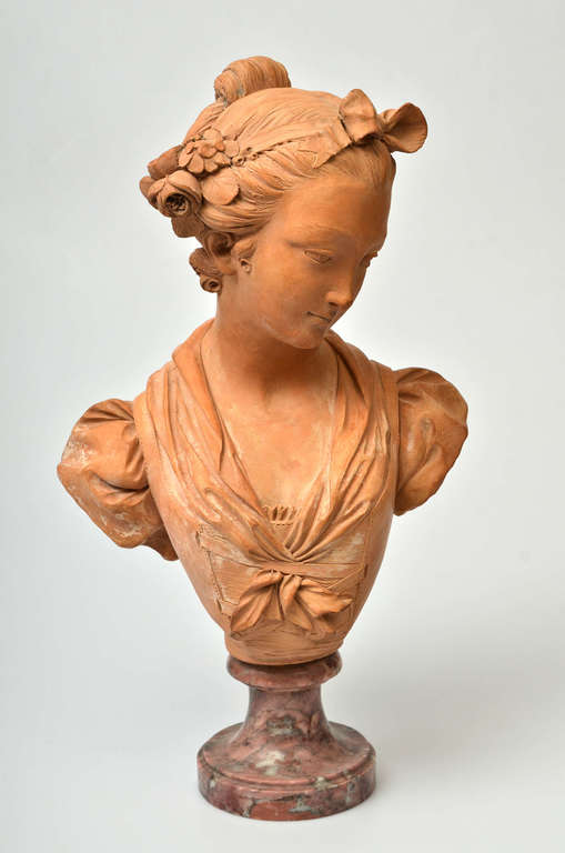 Terracotta bust on a marble base Bust of a Virgin