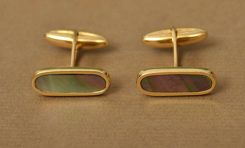 Gold cufflinks with mother of pearl