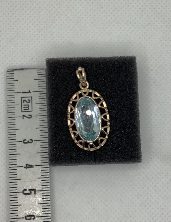 Antique gold pendant with emerald topaz. Art Deck.