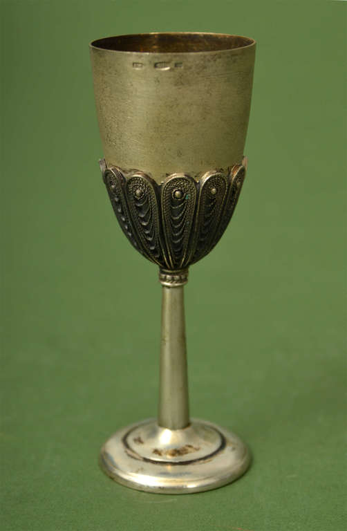 Silver cup on a leg