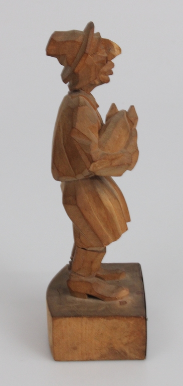 Wooden figure with a silver 