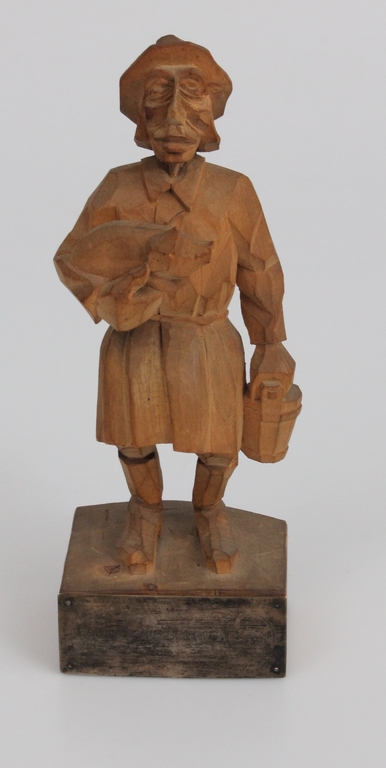 Wooden figure with a silver 
