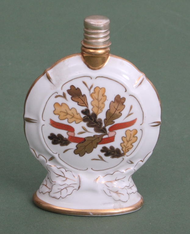 Two porcelain perfume bottles and a box/chest 