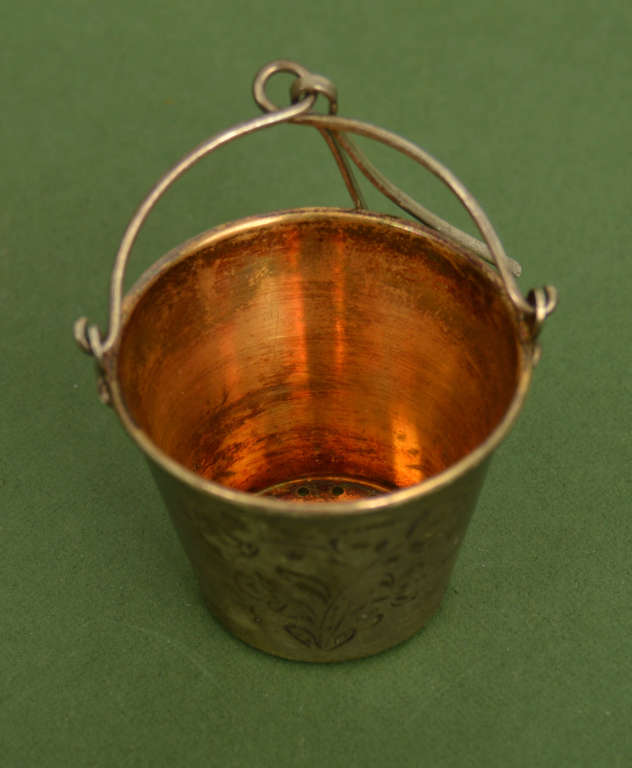 Silver tea strainer with engraving