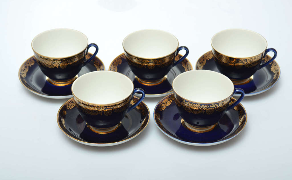 Five cups with saucers