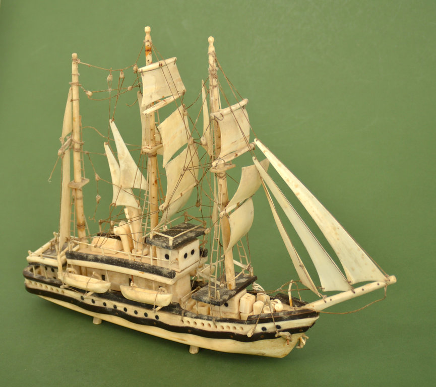 A model of a ship made of a sea lion's fang
