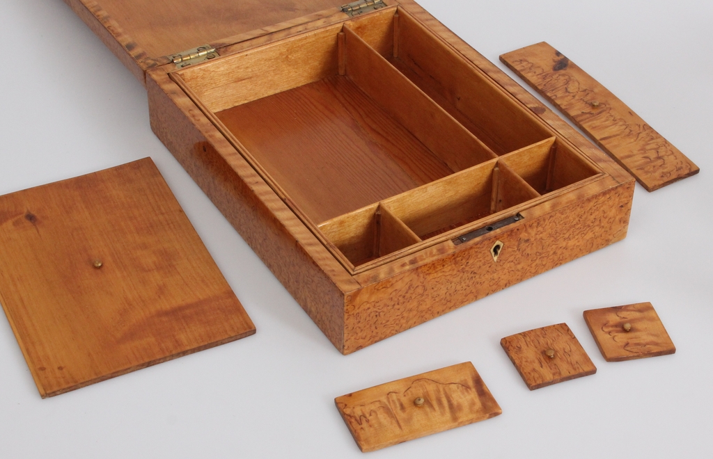 Wooden chest with several compartments