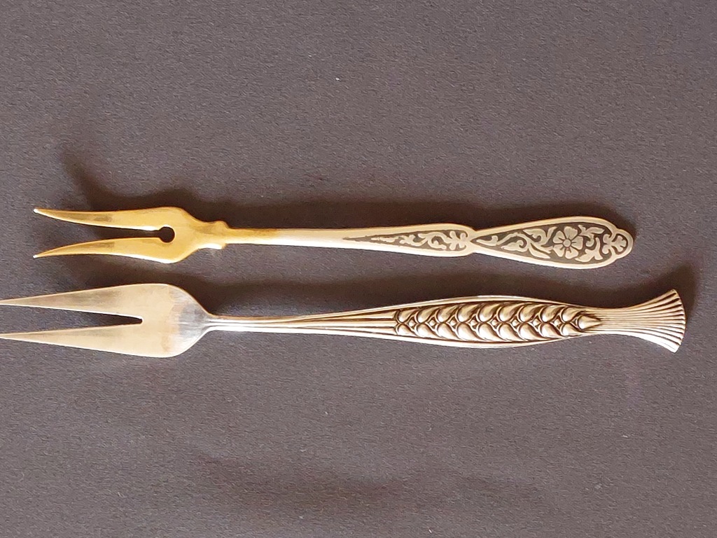 Two serving forks. 1.silver 2.metals