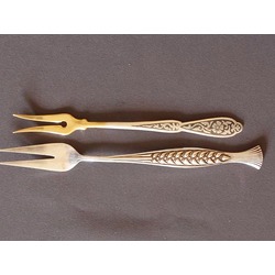Two serving forks. 1.silver 2.metals