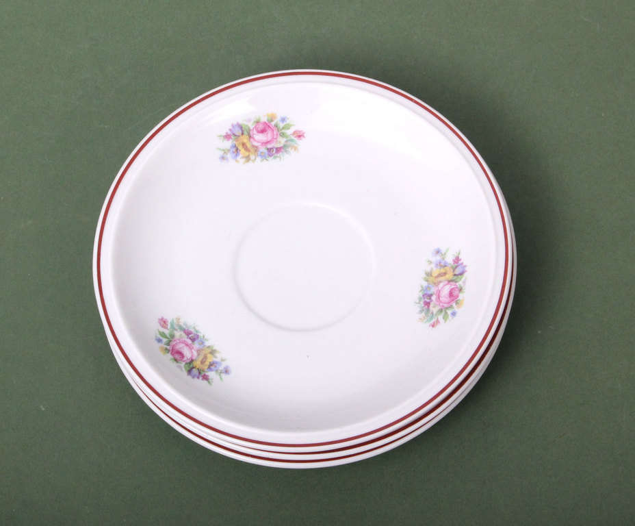 Three saucers with floral decor