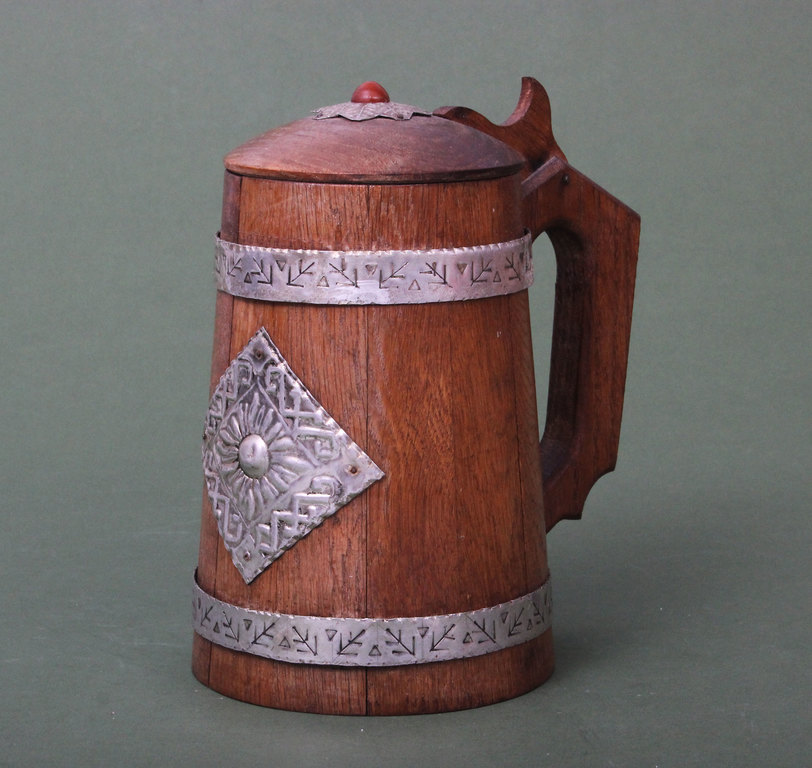 Wooden beer cup with metal ornaments