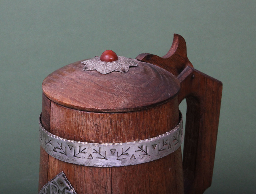 Wooden beer cup with metal ornaments