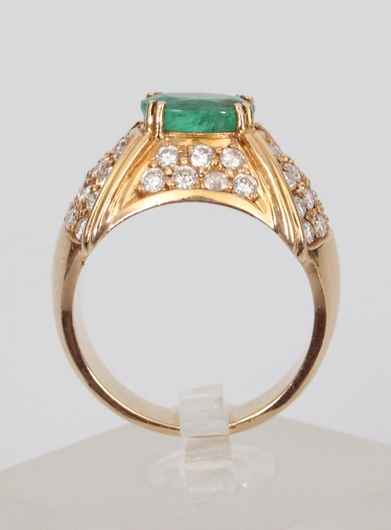 Yellow gold ring with 48 diamonds and 1 natural emerald