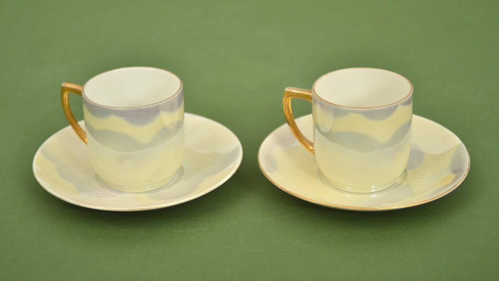 Two cups with saucers