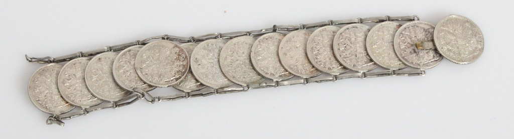A silver bracelet made of coins (With defect)