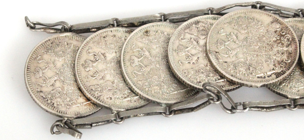 A silver bracelet made of coins (With defect)