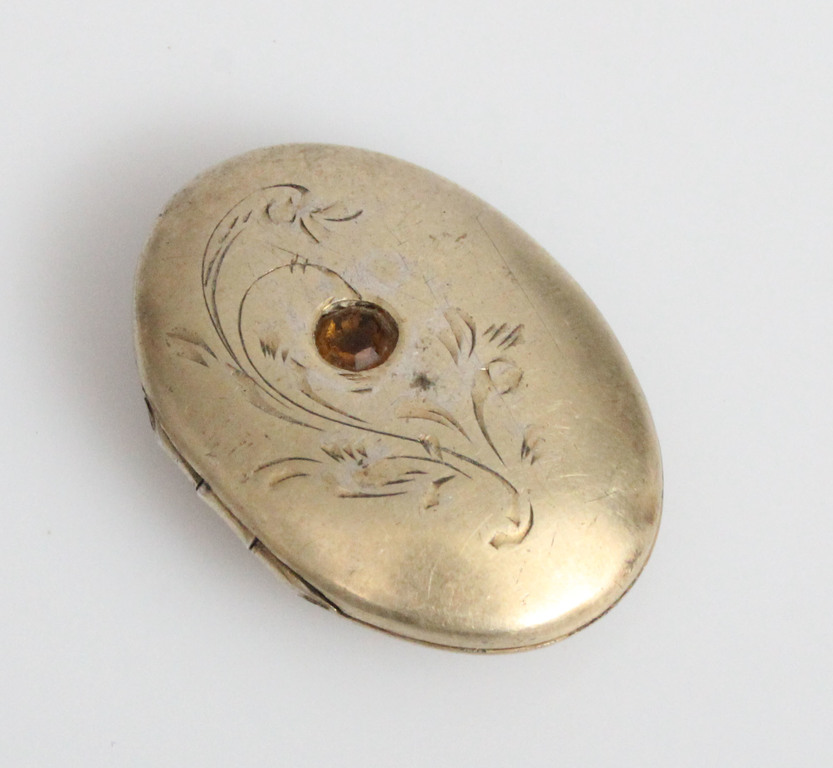 Silver pendant with a decorative stone