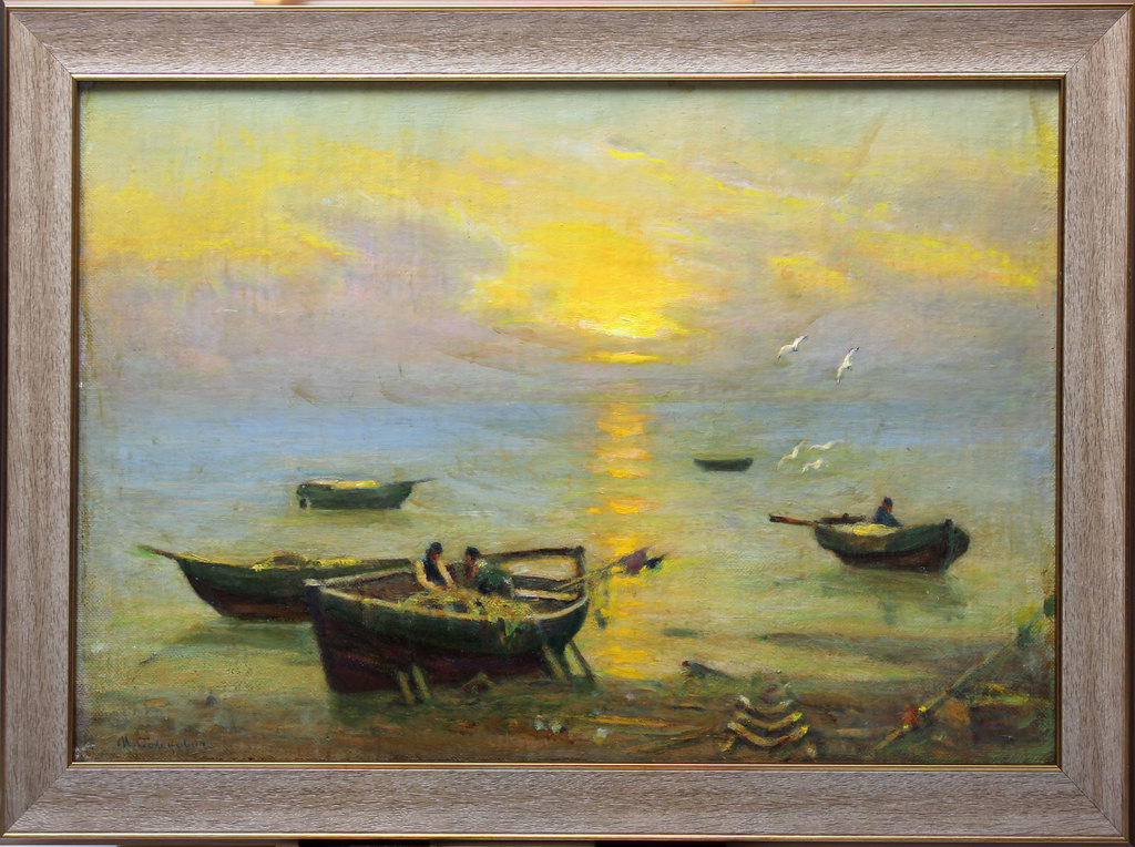 Fishing boats in the sea at sunrise