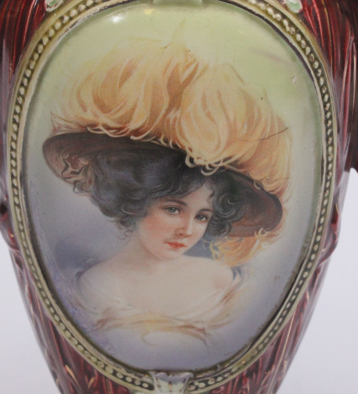 Porcelain vase with a portrait of a woman