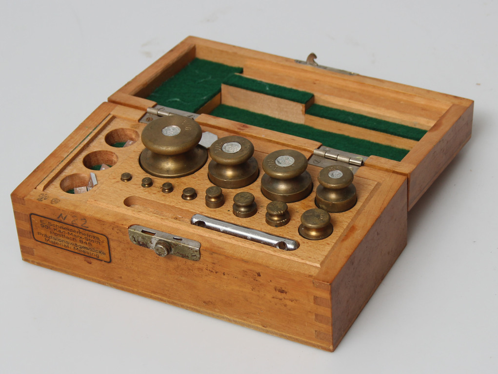 Set of brass weights in a wooden box