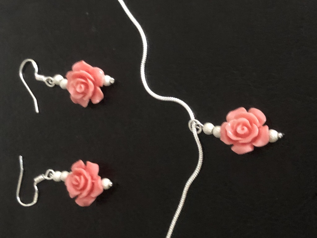 Silver earrings with coral roses and a pendant with a chain