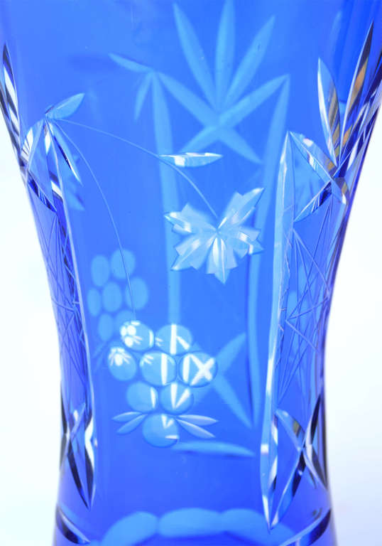 Blue glass vase with hand cut ornament