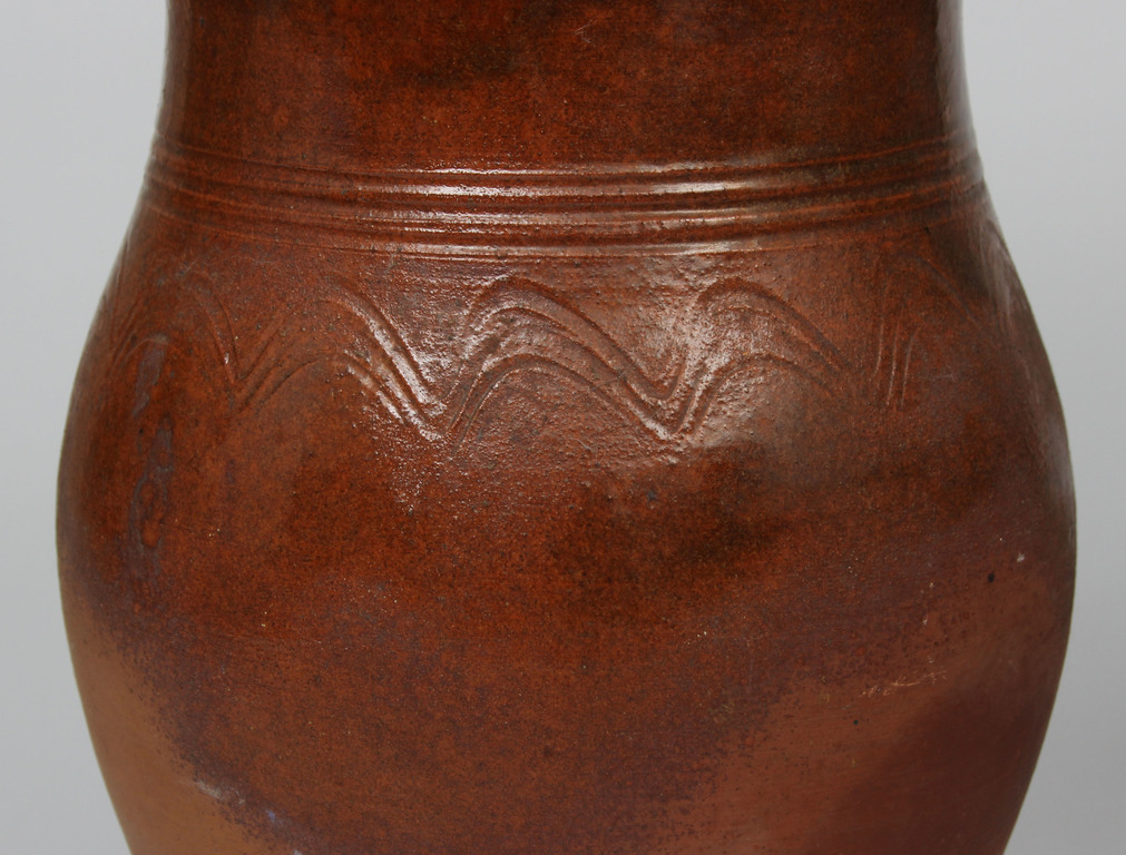 Clay vase with ornament