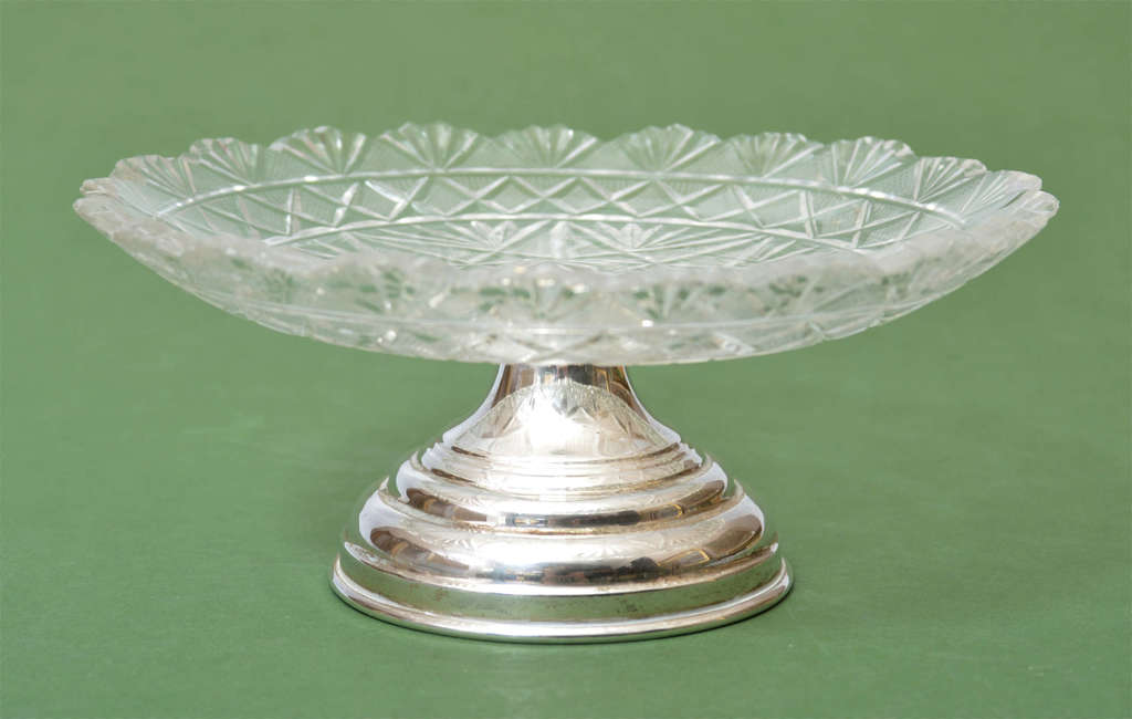 A luxurious sweets server with a silver foot