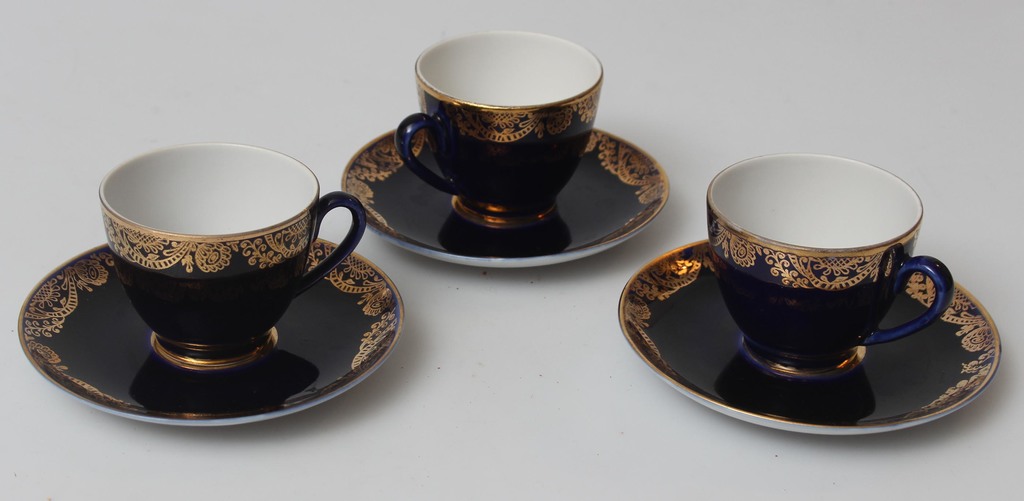 Three porcelain cups with saucers