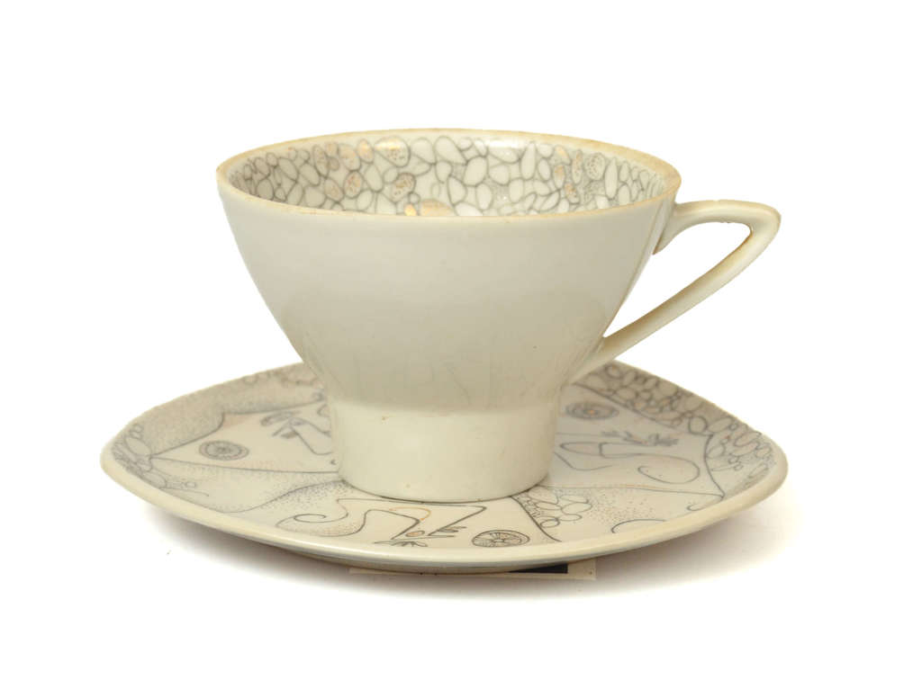 Painted porcelain  coffee cup with saucer