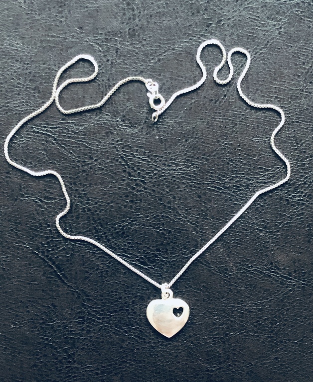 Silver pendant with chain. The 80s.