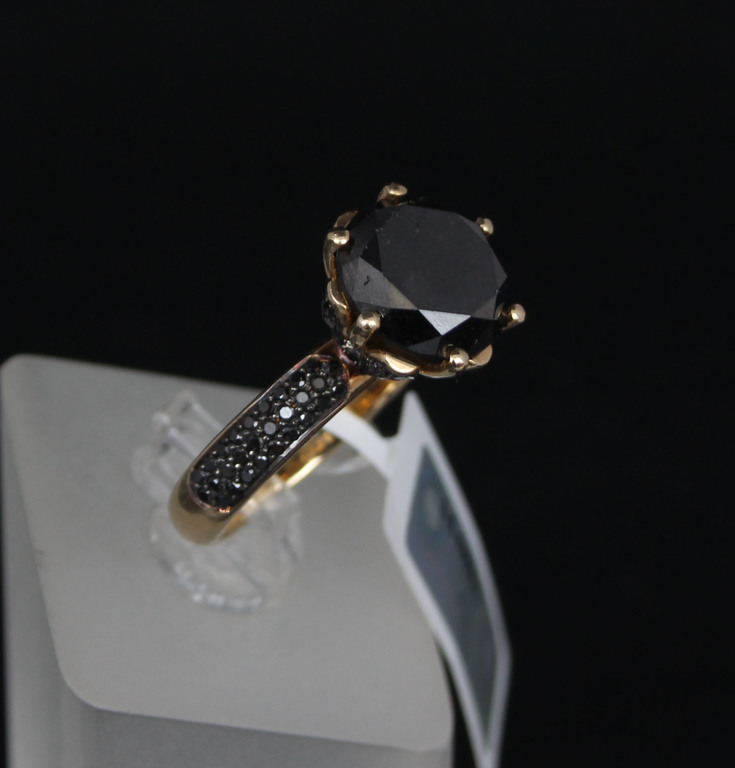 Gold ring with black diamonds