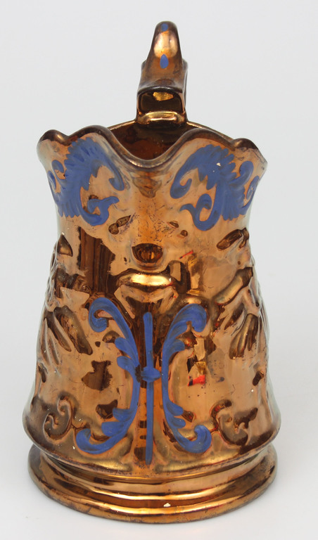 Painted porcelain jug with a dance motif
