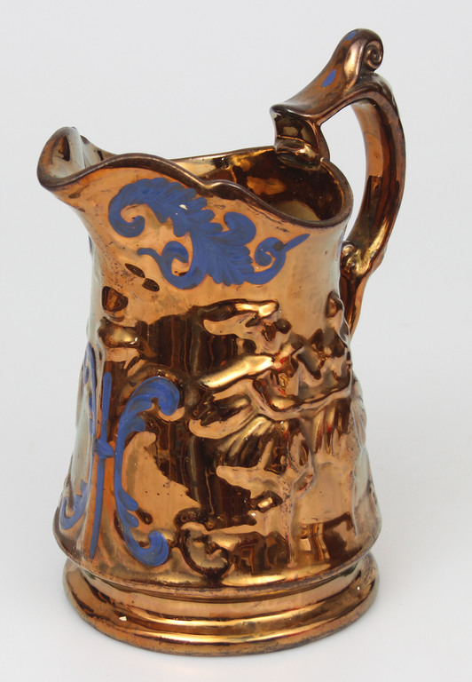 Painted porcelain jug with a dance motif