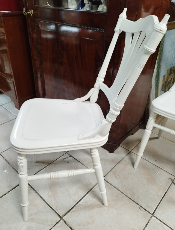 Two white wooden chairs