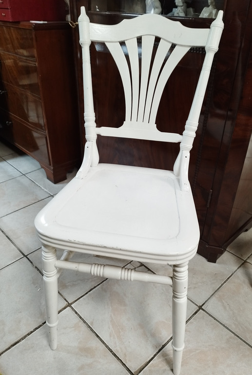 Two white wooden chairs