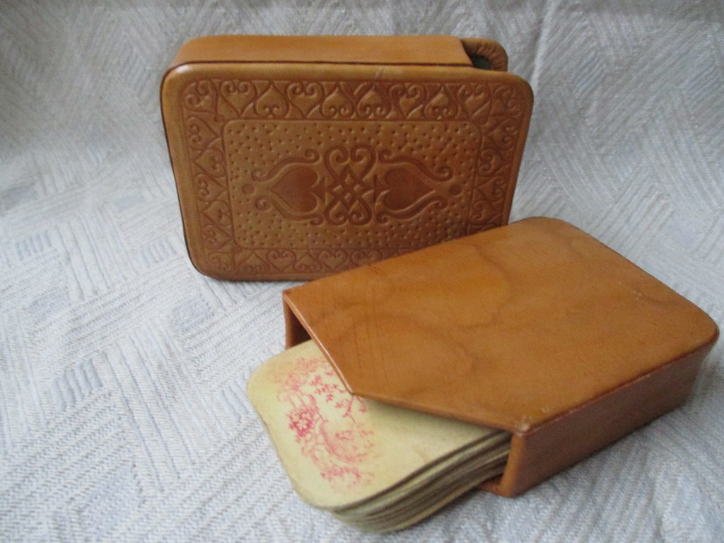 Vintage playing cards in a leather case