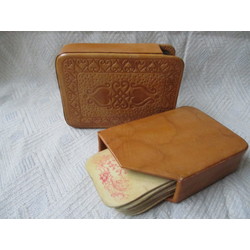 Vintage playing cards in a leather case