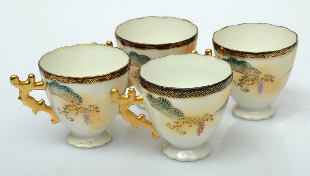 Vintage Japanese porcelain cups with gilt painting and a beautiful curved gilt handle