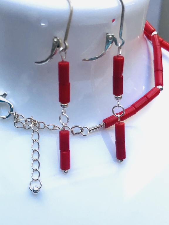 A trio of coral and silver jewelry