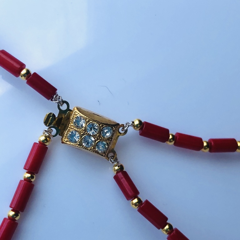 Coral necklace with gold-plated silver balls.