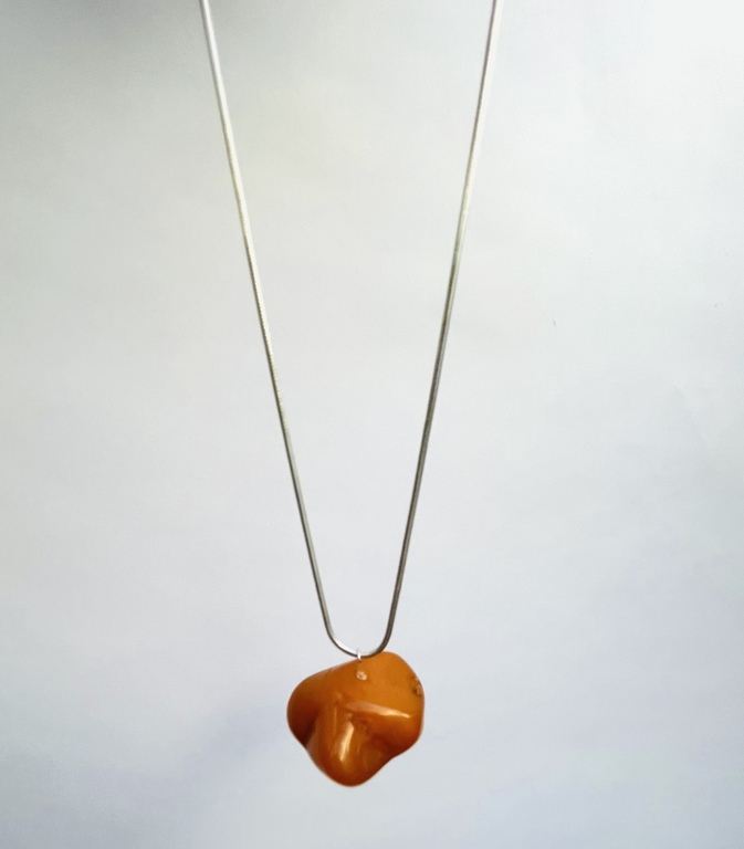 Vintage amber pendant on a silver chain