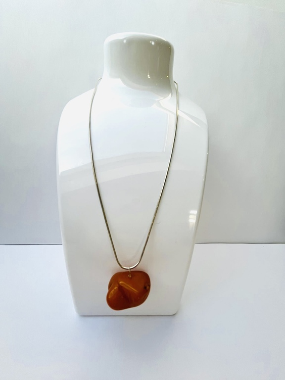 Vintage amber pendant on a silver chain