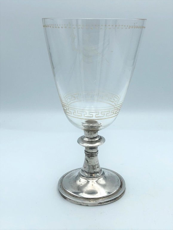 Glass cup with silver foot
