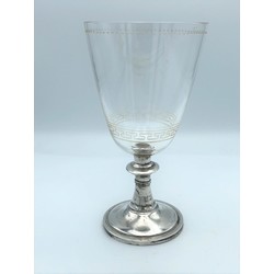 Glass cup with silver foot
