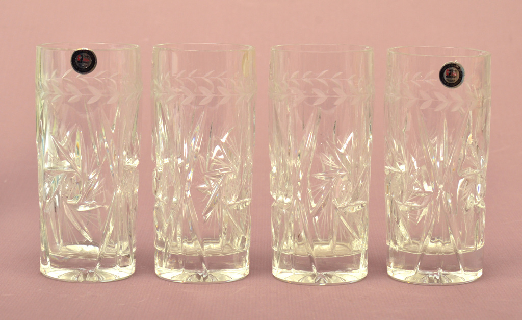 Set of four crystal glasses with labels