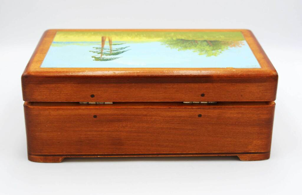 A wooden casket with a painting