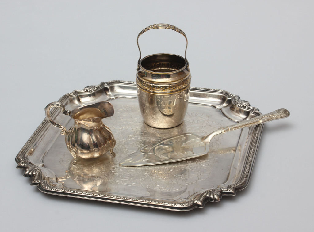 Metal tray, a cake showel, a cream container, and a dish